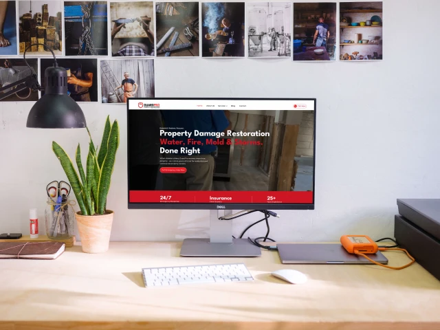 GuardPro Property Restoration website shown on a laptop