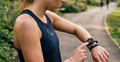 Runner checking a fitness tracker on a smartwatch