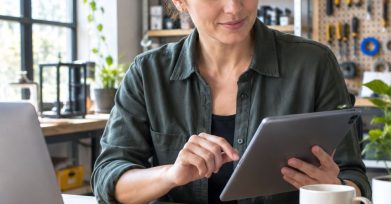 Small business owner reviewing a custom software workflow on a tablet